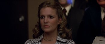 Movie still from “Capricorn One” (1977), directed by Peter Hyams – A person wearing a necklace; Close Up shot, Low angle