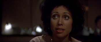 Movie still from “Capricorn One” (1977), directed by Peter Hyams – A person looking up at something; Close Up shot, High angle