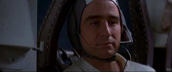 Movie still from “Capricorn One” (1977), directed by Peter Hyams – A person wearing a helmet; Close Up shot, Low angle
