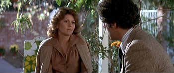 Movie still from “Capricorn One” (1977), directed by Peter Hyams – A woman and a man are sitting on a porch; Medium shot, Over the shoulder angle