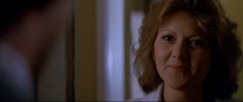 Movie still from “Capricorn One” (1977), directed by Peter Hyams – A woman's face in a dark room; Close Up shot, Low angle