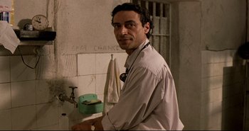 Movie still from “Carandiru” (2003), directed by Hector Babenco – A man is standing in front of a bathroom sink; Close Up shot, Low angle