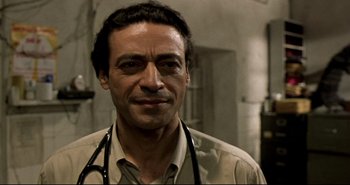Movie still from “Carandiru” (2003), directed by Hector Babenco – A person with a stethoscope; Close Up shot, Low angle