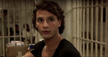 Movie still from “Carandiru” (2003), directed by Hector Babenco – A person wearing a black t - shirt; Close Up shot, High angle