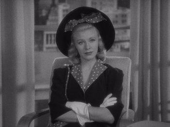 Movie still from “Carefree” (1938), directed by Mark Sandrich – A black and white photo of a woman in a hat; Close Up shot, Low angle