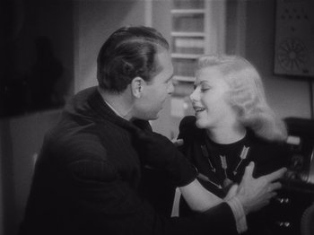 Movie still from “Carefree” (1938), directed by Mark Sandrich – An older man and a younger woman are smiling together; Close Up shot, High angle