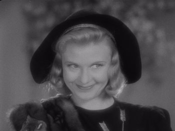 Movie still from “Carefree” (1938), directed by Mark Sandrich – A black and white photo of a woman wearing a hat; Close Up shot, Low angle