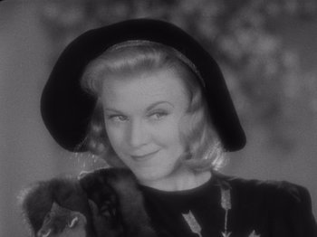 Movie still from “Carefree” (1938), directed by Mark Sandrich – An old photo of a woman and a dog; Close Up shot, Low angle