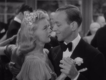 Movie still from “Carefree” (1938), directed by Mark Sandrich – A man and a woman dancing in a ballroom; Close Up shot, High angle