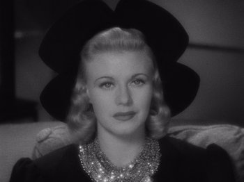 Movie still from “Carefree” (1938), directed by Mark Sandrich – An old black and white photo of a woman wearing a large hat; Close Up shot, Low angle