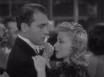 Movie still from “Carefree” (1938), directed by Mark Sandrich – A man and a woman in a black and white photo; Close Up shot, Over the shoulder angle