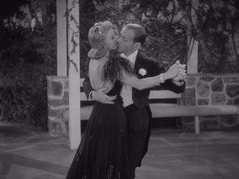 Movie still from “Carefree” (1938), directed by Mark Sandrich – A man and a woman in formal wear dancing; Medium shot, High angle
