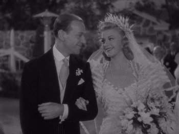 Movie still from “Carefree” (1938), directed by Mark Sandrich – An old black and white photo of a man and a woman; Close Up shot, High angle