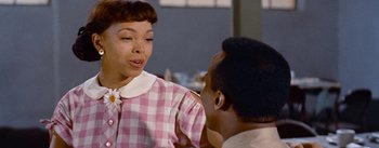 Movie still from “Carmen Jones” (1954), directed by Otto Preminger – An older woman talking to an older man in a kitchen; Close Up shot, Over the shoulder angle
