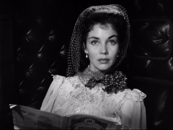 Movie still from “Carrie” (1952), directed by William Wyler – Black and white photograph of a woman in a veil; Close Up shot, Low angle