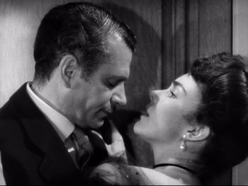 Movie still from “Carrie” (1952), directed by William Wyler – A man and a woman are looking into each others eyes; Close Up shot, High angle