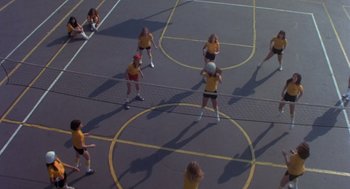 Movie still from “Carrie” (1976), directed by Brian De Palma – A group of women playing a game of volleyball; Extreme Wide shot, Overhead angle
