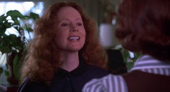 Movie still from “Carrie” (1976), directed by Brian De Palma – A person with long hair; Close Up shot, Over the shoulder angle