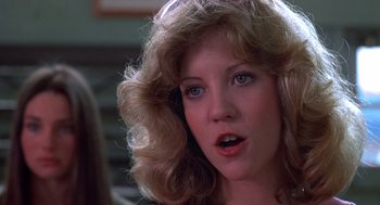 Movie still from “Carrie” (1976), directed by Brian De Palma – A person with long blonde hair; Close Up shot, Low angle