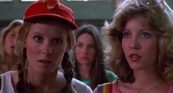 Movie still from “Carrie” (1976), directed by Brian De Palma – A group of women standing next to each other in a room; Close Up shot, Low angle