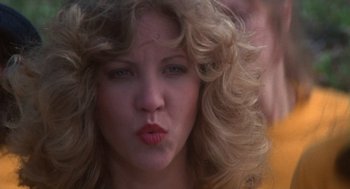 Movie still from “Carrie” (1976), directed by Brian De Palma – A person with curly hair; Close Up shot, Low angle