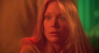 Movie still from “Carrie” (1976), directed by Brian De Palma – A person with long blonde hair; Close Up shot, Low angle