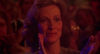 Movie still from “Carrie” (1976), directed by Brian De Palma – A person with her hand near her face; Close Up shot, Over the shoulder angle