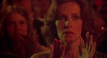 Movie still from “Carrie” (1976), directed by Brian De Palma – A person clapping their hands; Close Up shot, Over the shoulder angle