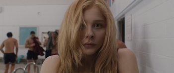 Movie still from “Carrie” (2013), directed by Kimberly Peirce – A person with blonde hair; Close Up shot, Low angle