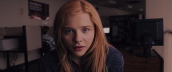 Movie still from “Carrie” (2013), directed by Kimberly Peirce – A person with long red hair; Close Up shot, Low angle