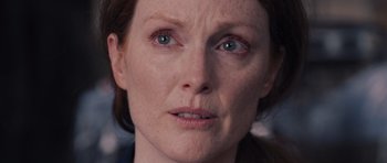 Movie still from “Carrie” (2013), directed by Kimberly Peirce – A woman's face with blue eyes; Close Up shot, Over the shoulder angle