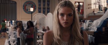 Movie still from “Carrie” (2013), directed by Kimberly Peirce – A beautiful young lady with long blonde hair; Close Up shot, Over the shoulder angle