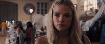 Movie still from “Carrie” (2013), directed by Kimberly Peirce – A beautiful young lady with long blonde hair; Close Up shot, Over the shoulder angle