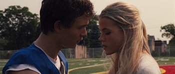 Movie still from “Carrie” (2013), directed by Kimberly Peirce – A boy and a girl face to face on a soccer field; Close Up shot, Over the shoulder angle