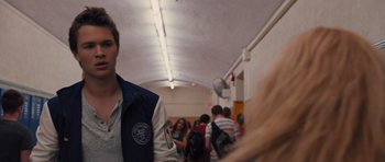 Movie still from “Carrie” (2013), directed by Kimberly Peirce – A group of people standing in a hallway; Close Up shot, Over the shoulder angle