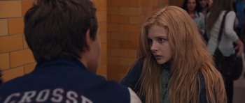 Movie still from “Carrie” (2013), directed by Kimberly Peirce – A young boy and a young girl looking at each other; Close Up shot, Over the shoulder angle