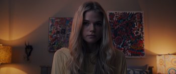 Movie still from “Carrie” (2013), directed by Kimberly Peirce – A beautiful young woman with long blonde hair; Close Up shot, Low angle