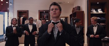 Movie still from “Carrie” (2013), directed by Kimberly Peirce – A young man in a suit and bow tie; Medium shot, Low angle