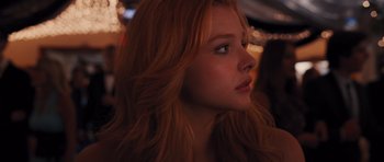 Movie still from “Carrie” (2013), directed by Kimberly Peirce – A person with long hair; Close Up shot, Low angle