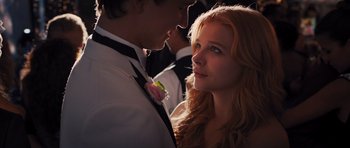 Movie still from “Carrie” (2013), directed by Kimberly Peirce – A man and a woman in formal wear standing next to each other; Close Up shot, Low angle