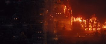 Movie still from “Carrie” (2013), directed by Kimberly Peirce – An aerial view of a fire burning in a city at night; Extreme Wide shot, High angle
