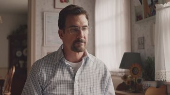 Movie still from “The Clovehitch Killer” (2018), directed by Duncan Skiles – A person wearing glasses and a plaid shirt; Close Up shot, Over the shoulder angle
