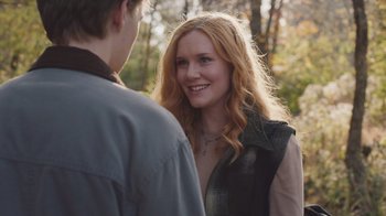 Movie still from “The Clovehitch Killer” (2018), directed by Duncan Skiles – A woman with long red hair standing next to a young man; Close Up shot, Over the shoulder angle