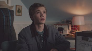 Movie still from “The Clovehitch Killer” (2018), directed by Duncan Skiles – A young man is looking up at the ceiling; Medium shot, Over the shoulder angle