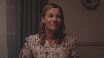 Movie still from “The Clovehitch Killer” (2018), directed by Duncan Skiles – A person wearing a floral shirt; Close Up shot, Over the shoulder angle