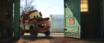 Movie still from “Cars 3” (2017), directed by Brian Fee – A car in front of a door; Wide shot, Low angle