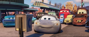 Movie still from “Cars 3” (2017), directed by Brian Fee – A car that is sitting in the street; Wide shot, Low angle