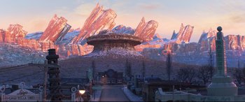 Movie still from “Cars 3” (2017), directed by Brian Fee – An image of an animated movie setting with mountains in the background; Extreme Wide shot, High angle