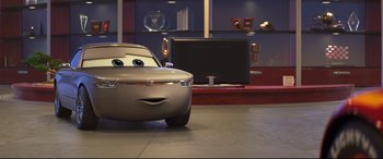 Movie still from “Cars 3” (2017), directed by Brian Fee – A silver car with eyes drawn on it's face; Wide shot, Low angle