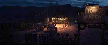 Movie still from “Cars 3” (2017), directed by Brian Fee – An old car parked in front of an old barn at night; Extreme Wide shot, High angle